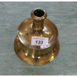 An early 17th Century brass Capstan candlestick with pierced socket,