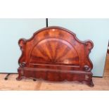 A Victorian figured mahogany footboard from a half tester bed