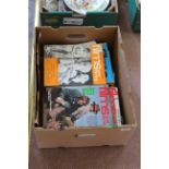 A box of 1970's films and filming magazines