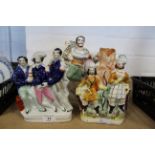 Three Staffordshire flat back figurines of a lion tamer,