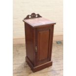 An Edwardian walnut pot cupboard