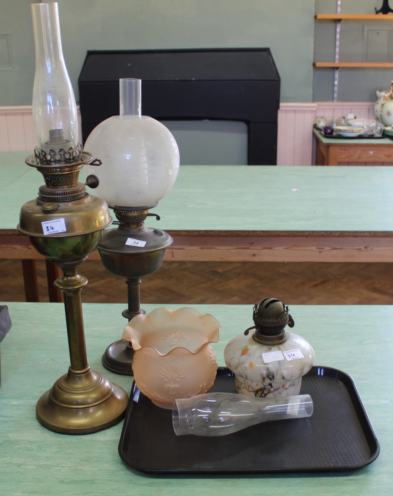 Three brass and glass oil lamps (one converted)