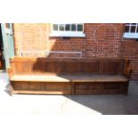 A Victorian oak and pine church pew,