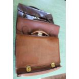 Three vintage leather satchels