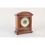 An Edwardian rosewood porcelain and gilt dial mantel clock