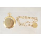 An 18ct gold pocket watch with inscription to back plate plus an 18ct gold watch chain with