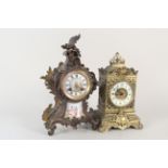 A late 19th Century brass mantel clock in the Rococo style with sevre style plaques plus a late