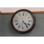 A mid Victorian mahogany round cased wall clock, fusee movement,