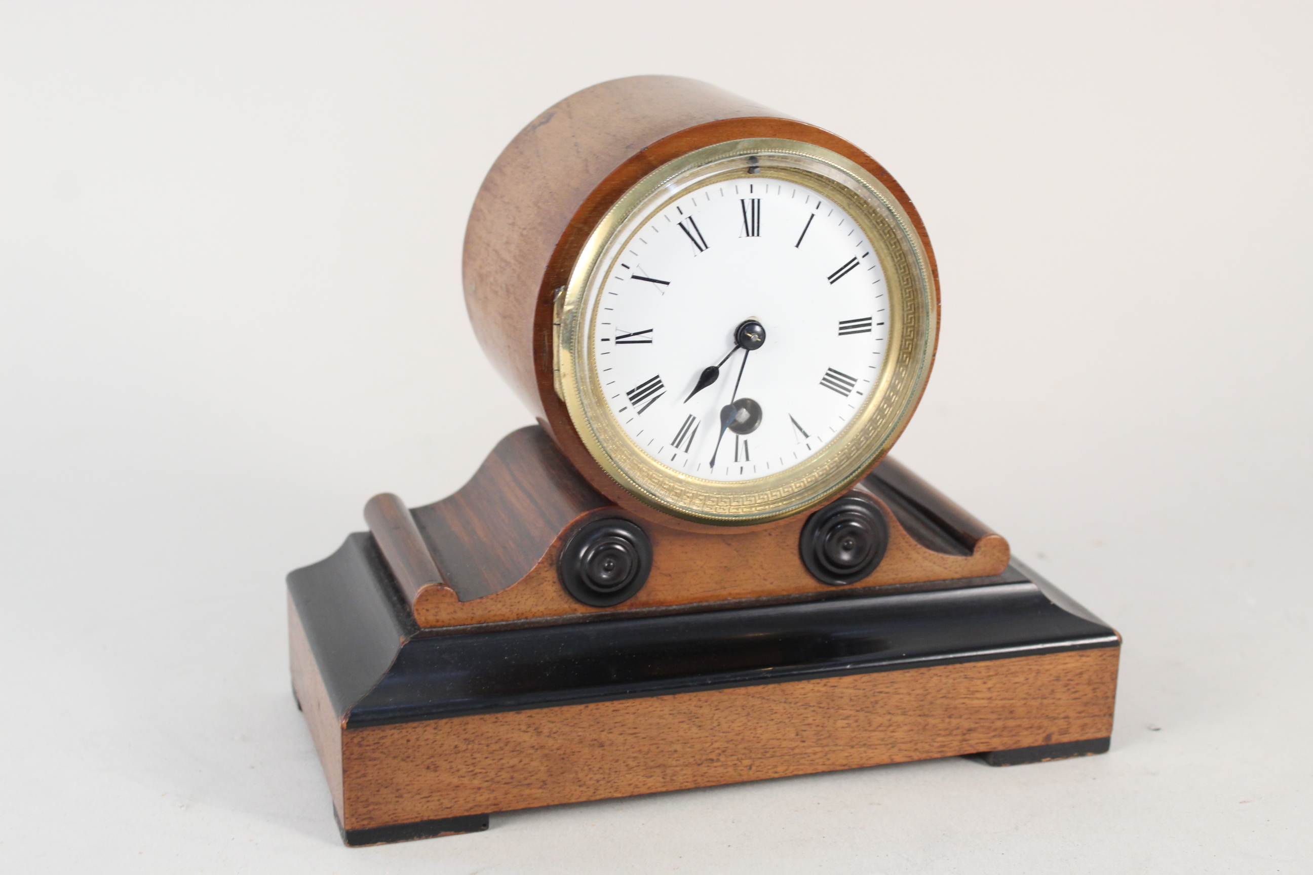 A late 19th Century mahogany cased mantel clock with plated plaque featuring Lowestoft reference