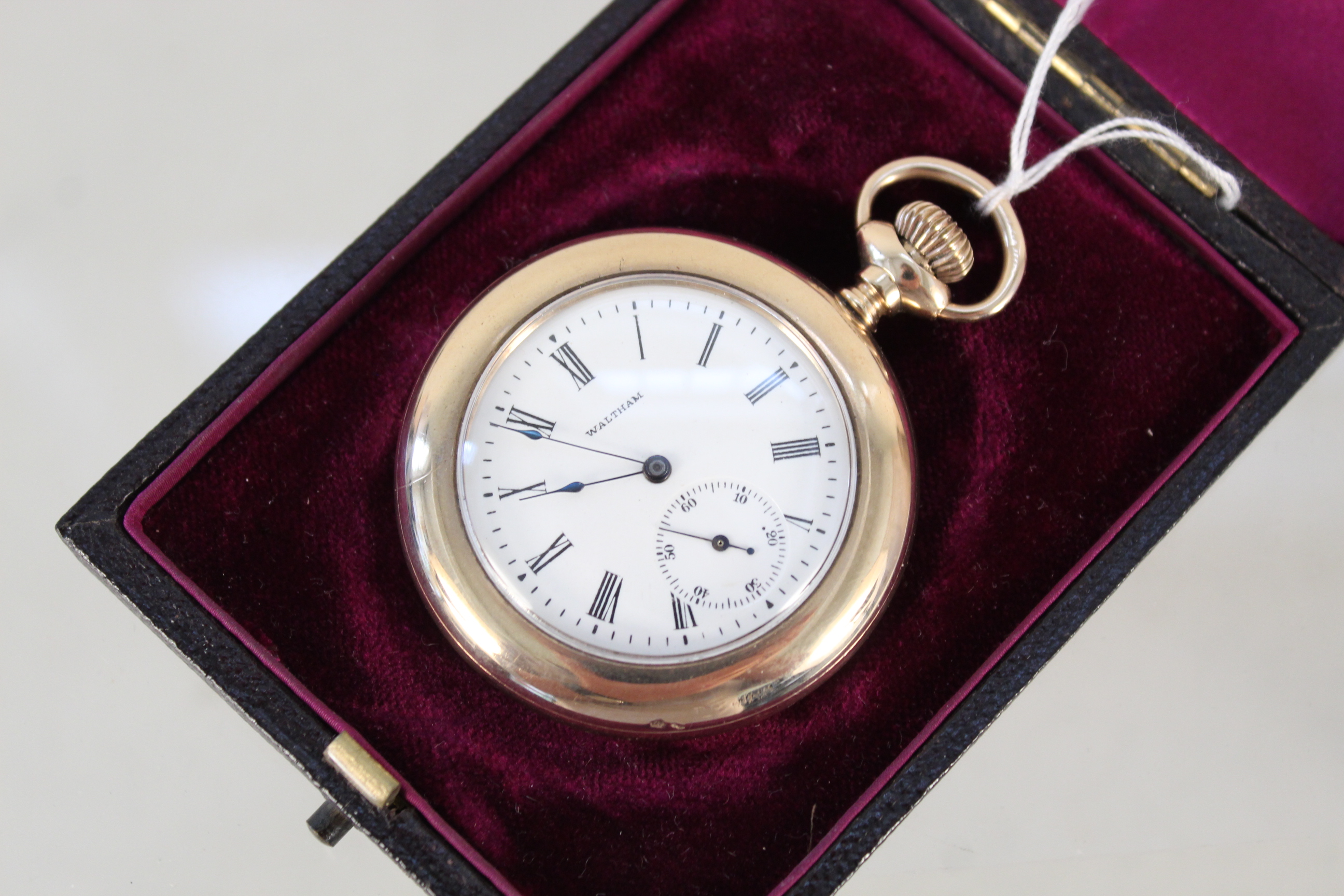 A Waltham gold plated pocket watch with sub dial