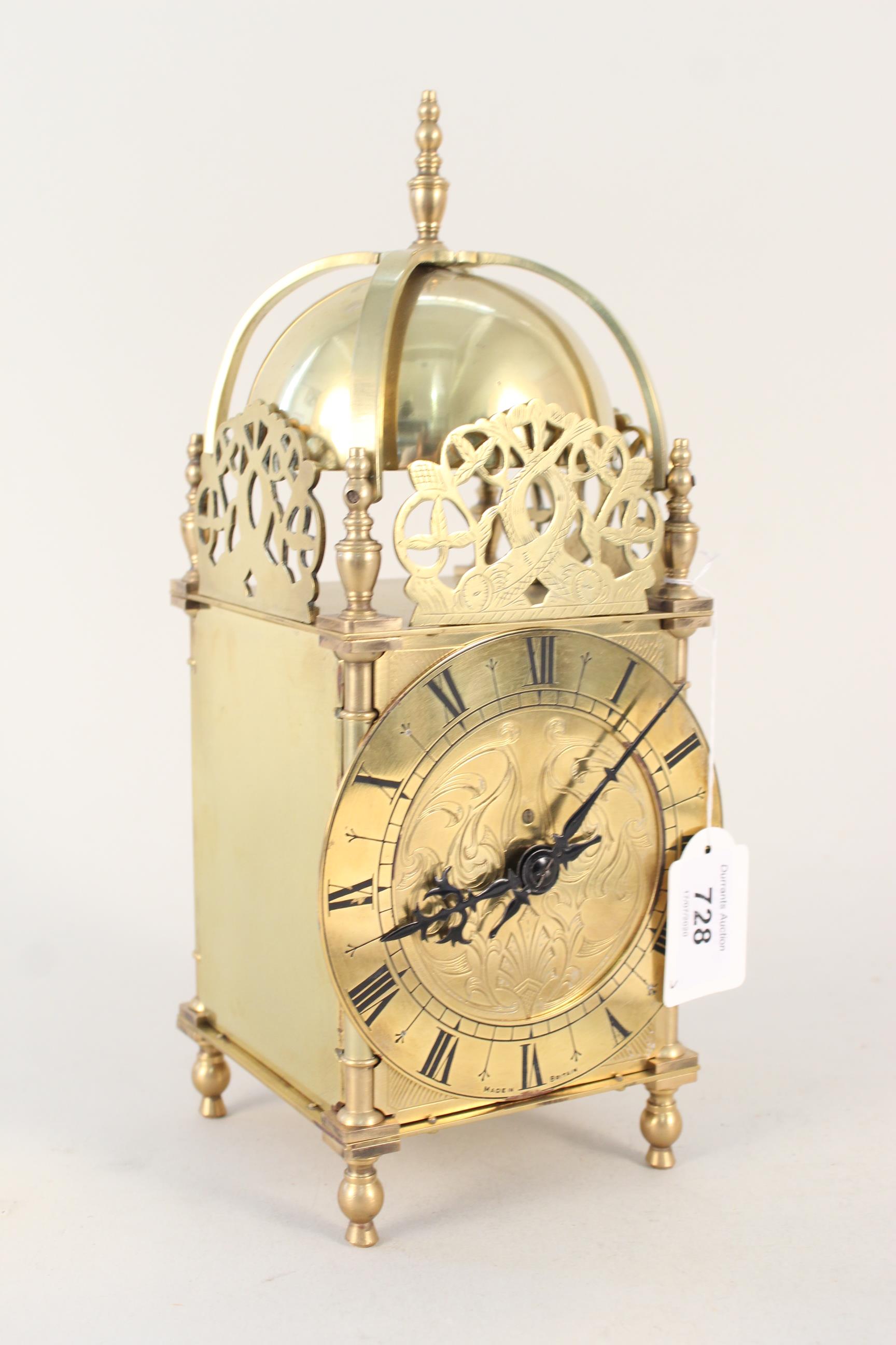 A good quality reproduction brass lantern clock