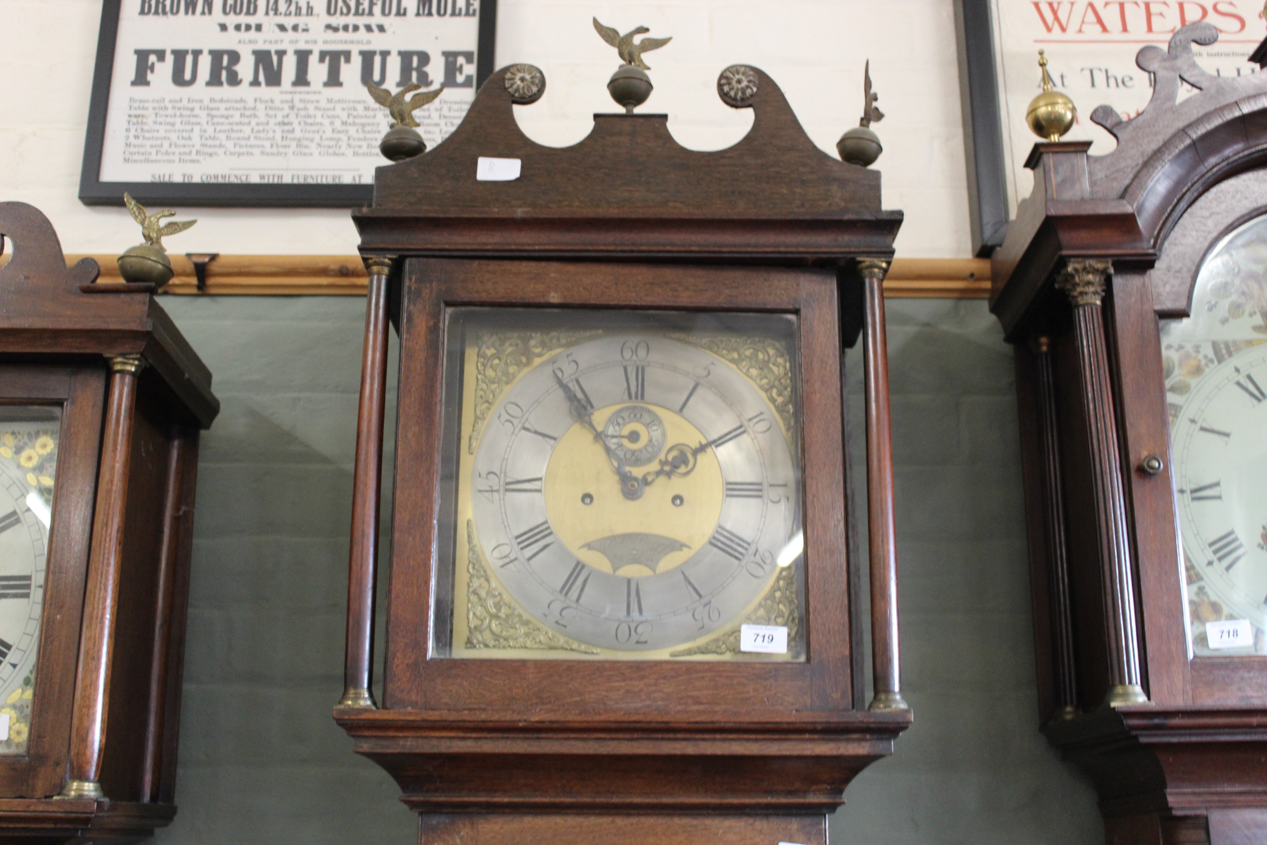 An oak long case clock c1800, the square dial with silvered chapter ring and brass spandrels,