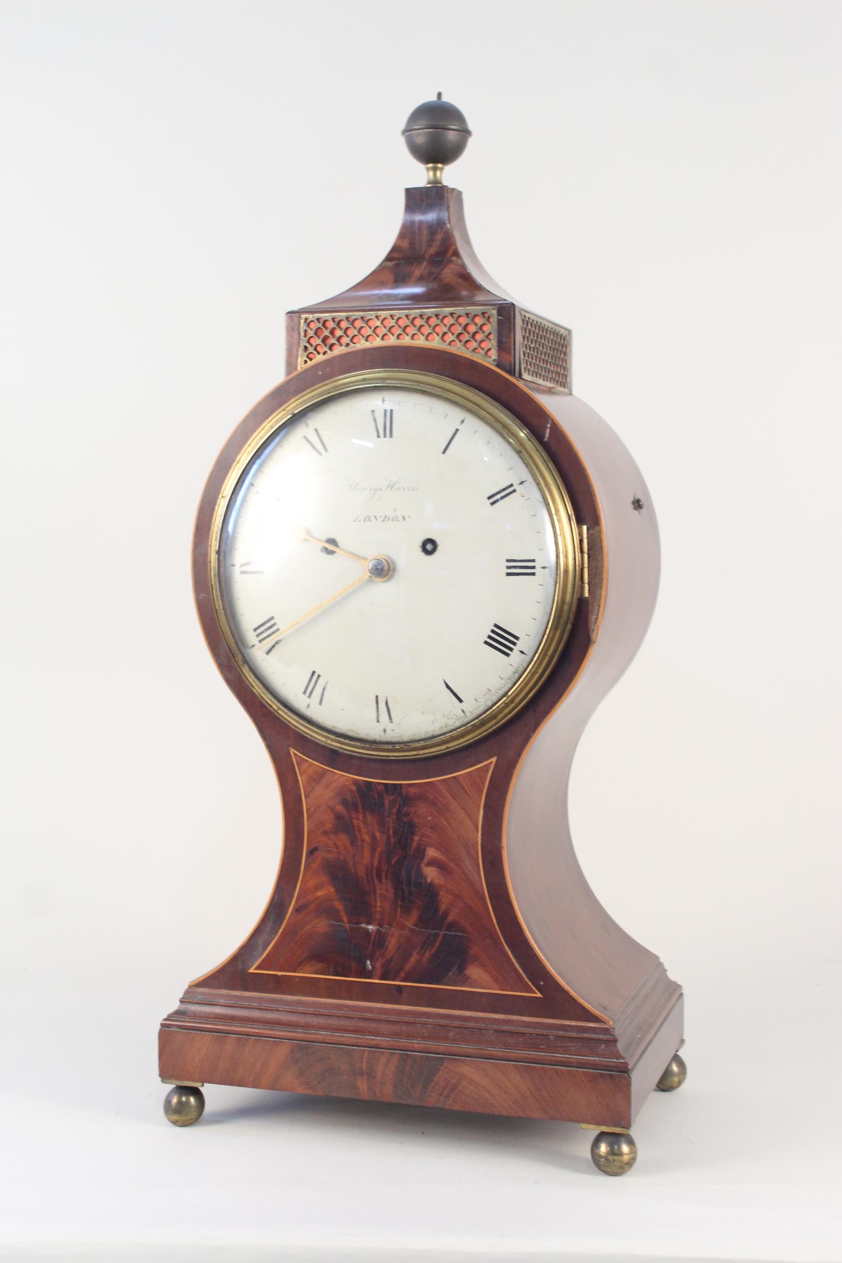 An inlaid mahogany balloon clock by Henry Harris,