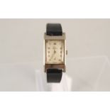 A gents Record 9ct gold 1930's wristwatch with swan logo