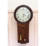 An early 19th Century mahogany trunk dial wall clock with well figured veneers to the case,