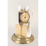 A German late 19th Century brass table clock in dome case