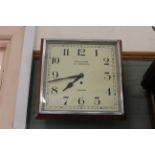 A 1930's chrome and oak Garrard wall clock,