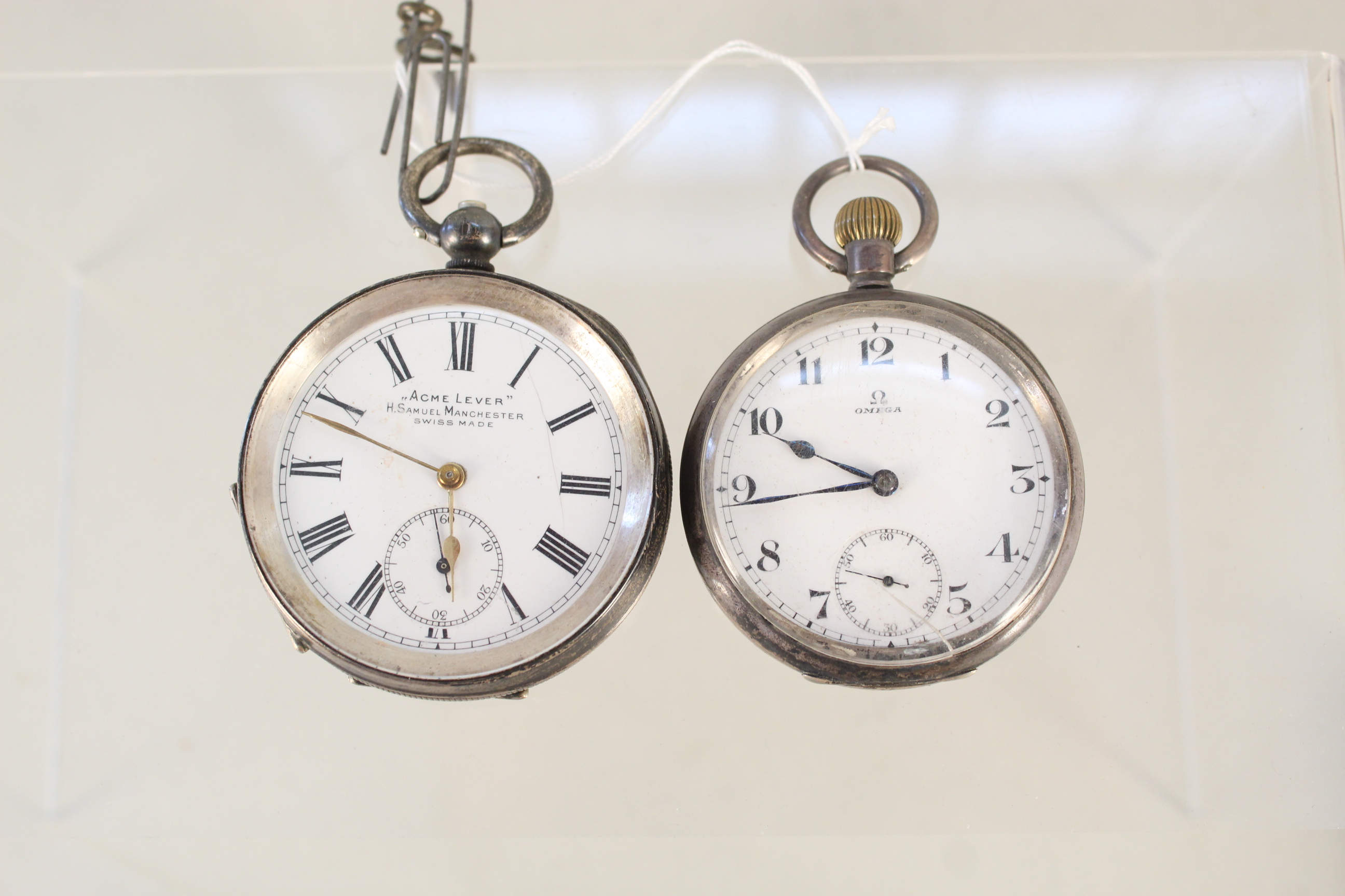 An Omega silver plated pocket watch plus an 'Acme Lever' pocket watch