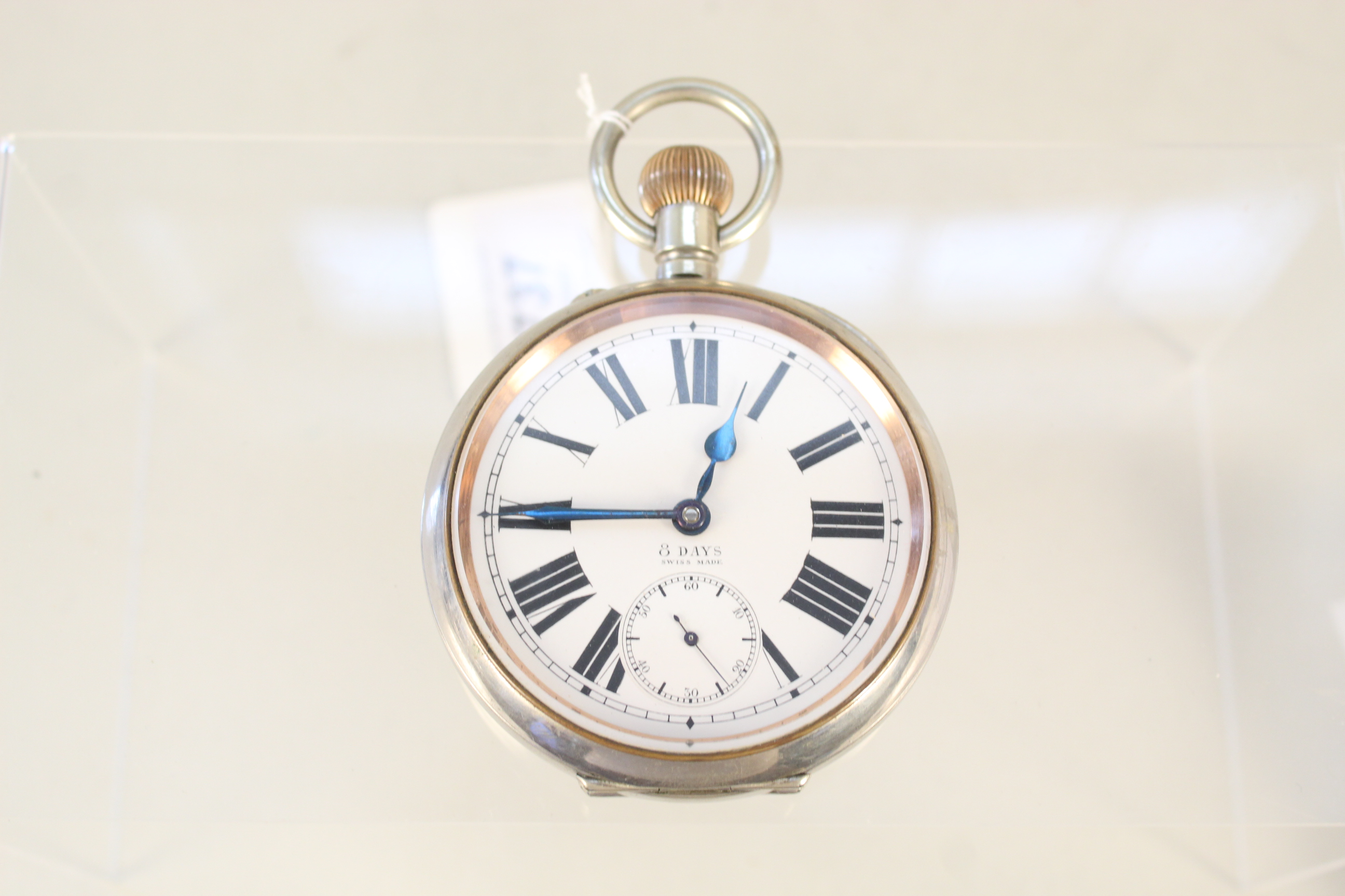 An 8 day nickel plated Goliath pocket watch