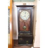 An oak cased clocking in machine 'The Glenhill-Brook' by Time Recorders Ltd