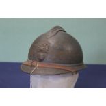 A French model 15 Adrian helmet with R F badge