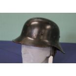 A German fire/police helmet with liner