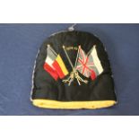 A WWI era tea cosy embroidered with flags and 1914-15