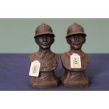 A pair of cast iron busts of a French soldier marked on front Verdun