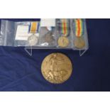 Two WWI Victory medals, a WWI War medal, a 1914/15 Star and a memorial plaque (which is very worn,