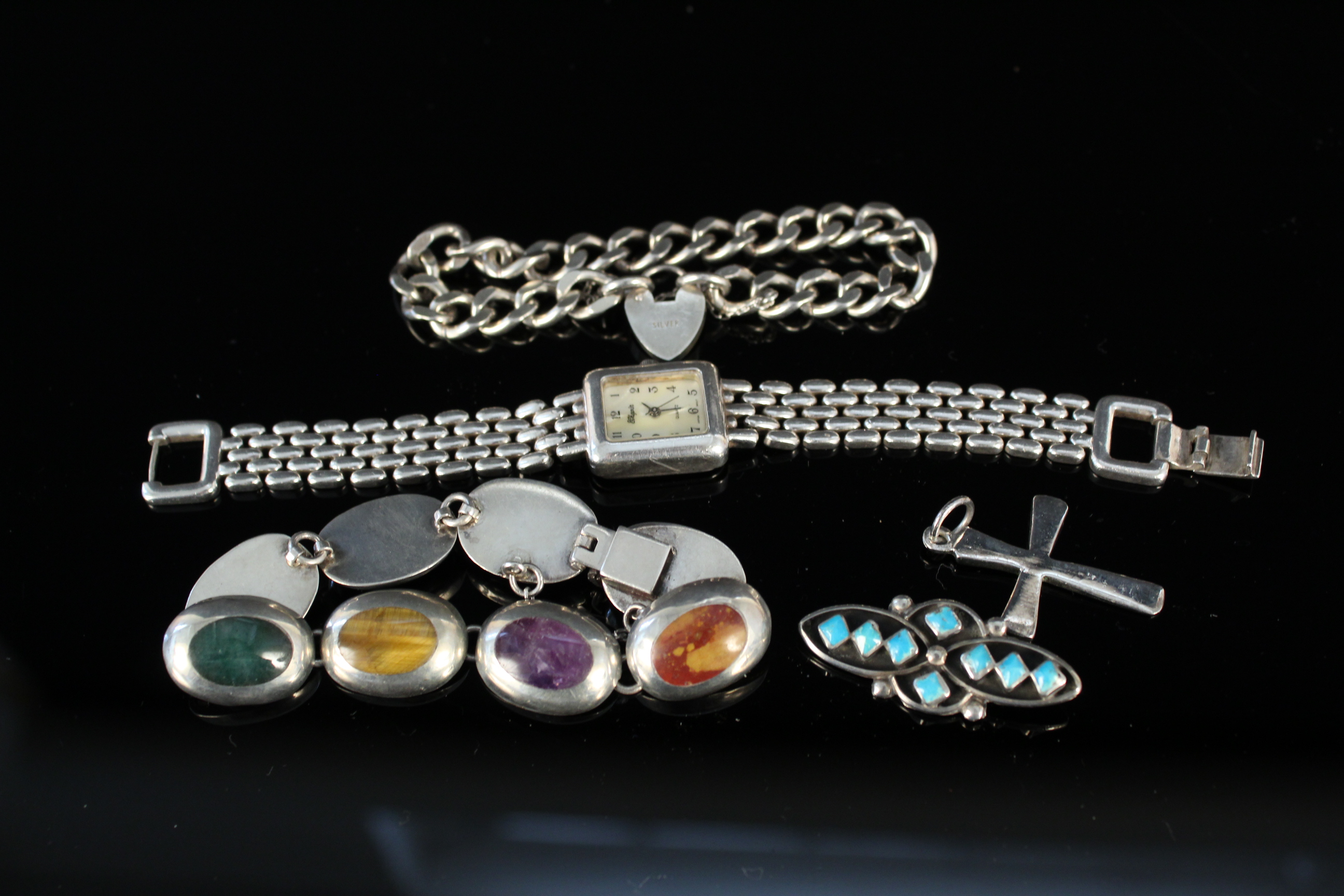 Sterling silver items to include bracelets, brooch,