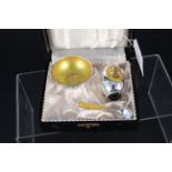A Danish silver yellow enamel decorated cruet set comprising of a pepper, salt dish and spoon,