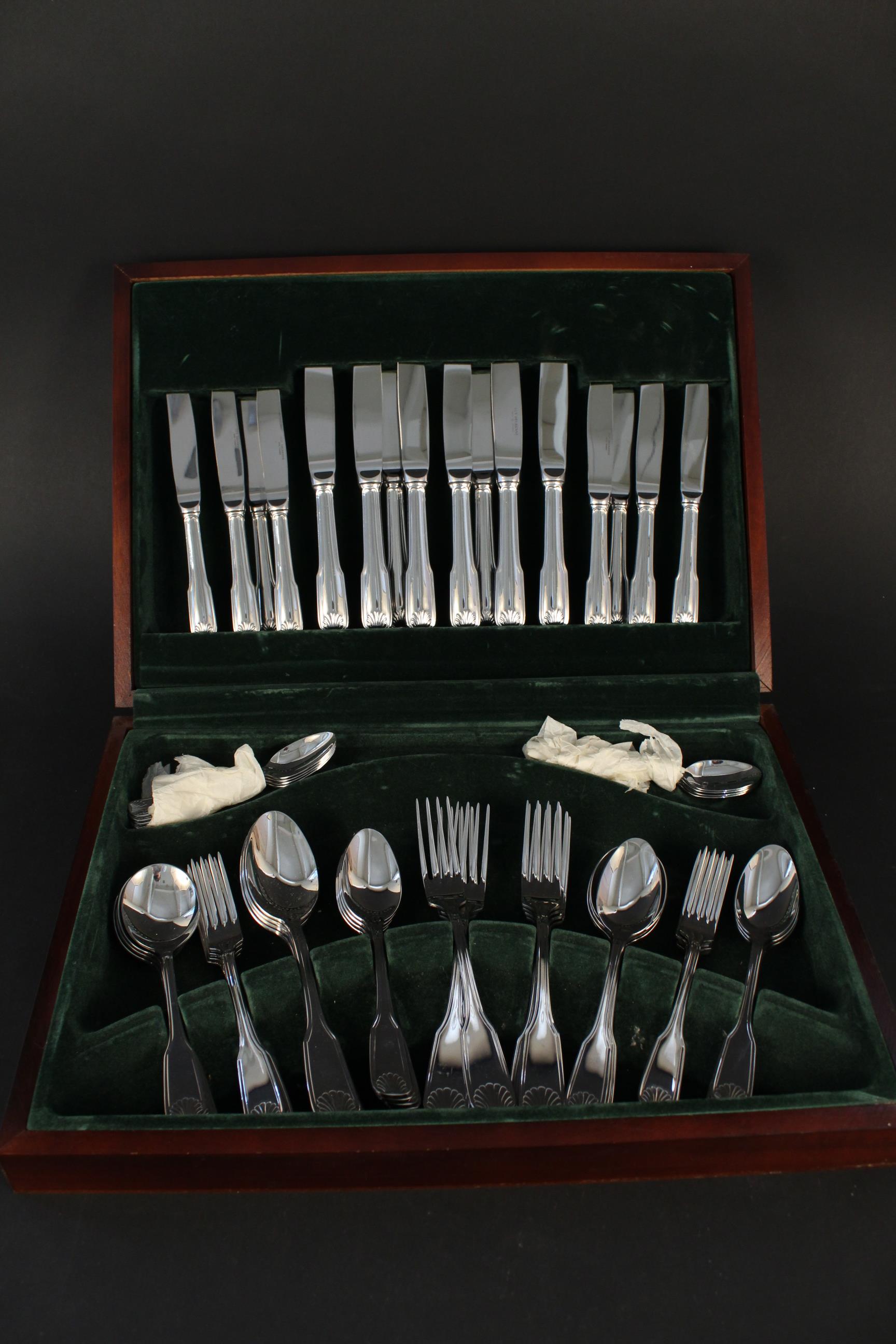 A wooden cased canteen of silver plated cutlery by Guy Degrenne, France,