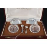 A boxed pair of Argentina Christofle glass and silver salts,