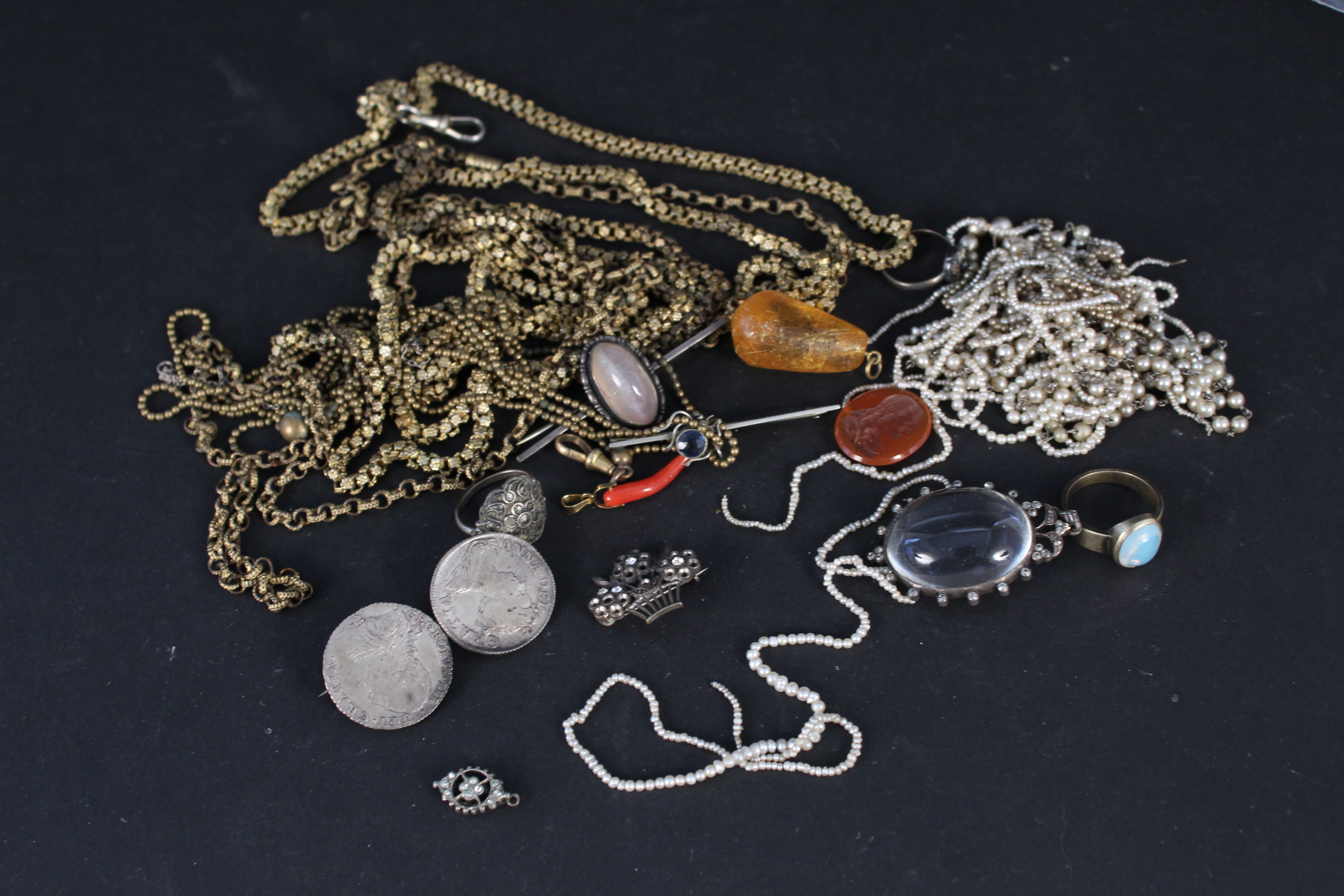 A collection of jewellery including two yellow metal long guard chains,