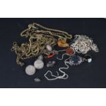 A collection of jewellery including two yellow metal long guard chains,