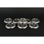 A set of eight silver rimmed glass coasters