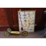 A vintage Triang scooter and a framed Eric Hill "Spot the Dog" alphabet poster