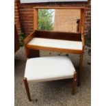 A 1970's teak style dressing table with lifting top with white leatherette covered stool on tapered