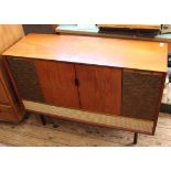 A vintage Decca Radiogram with turntable and original paperwork.