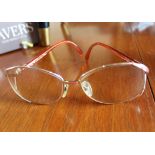 A pair of vintage Christian Dior reading glasses