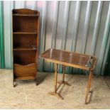 An oak freestanding bookcase with magazine rack to base and a wooden tea trolley with sliding top