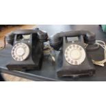 Two vintage bakelite telephones with braided cords and modern adapters