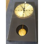 A mid Century Seth Thomas wall clock with smoked perspex front