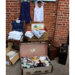 A large assortment of vintage items including as new boiler suits, suitcases, underwear,