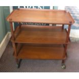 A Danish teak triple tier trolley,