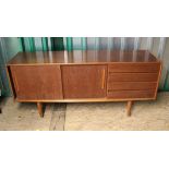 A Jentique sideboard with two sliding doors and four drawers on tapered legs,