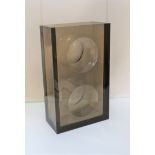 A 1970's Guzzini smoked acrylic vase of rectangular form with optic panels to each side, height 8",