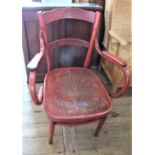 A striking red stained Jacob and Jesof Kohn bentwood armchair,