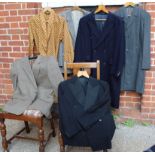 Various vintage men's clothing items including two jackets, two coats,