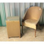 A gold loom style armchair and a matching linen basket